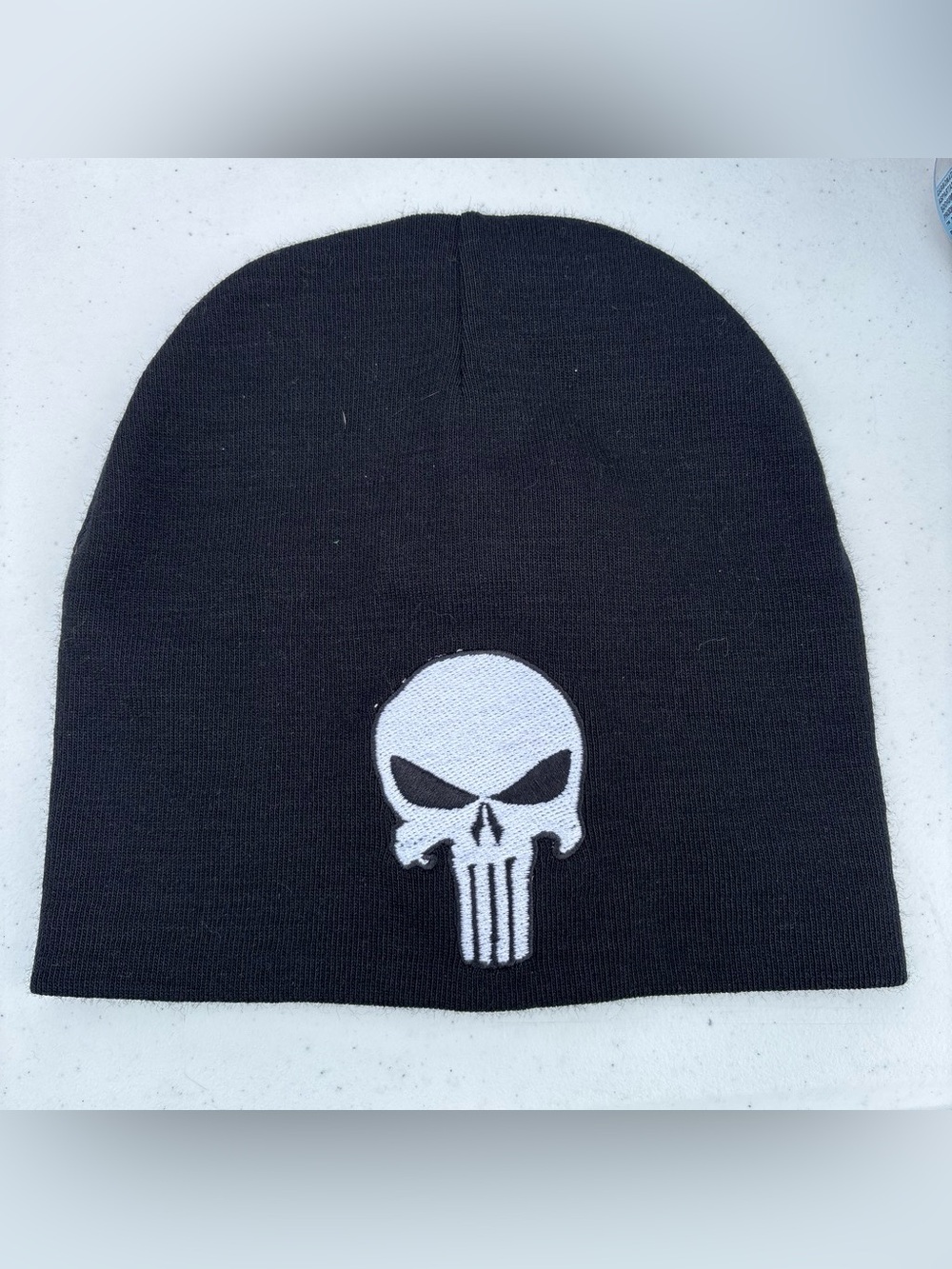Black Beanie Hat with White Skull Patch